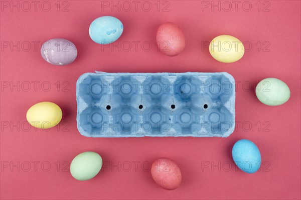 Colourful easter eggs with blue box table