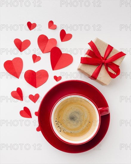 Flat lay cup coffee with valentines day present