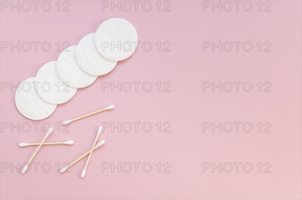 Flat lay arrangement with cotton pads ear sticks