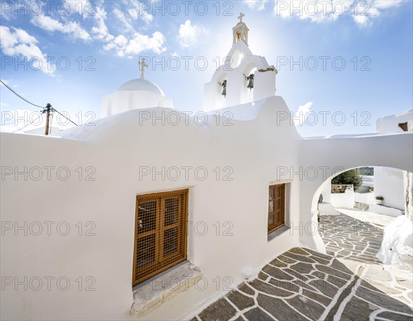 White Greek Orthodox church with sun star