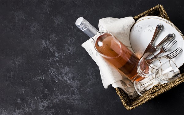 Basket with wine tableware with copy space