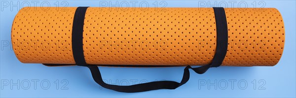 Top view yoga mat blue background
