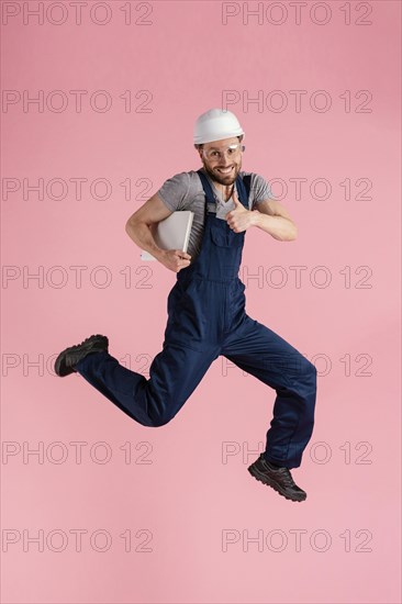 Portrait engineer man jumping