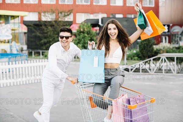 Happy woman shopping cart