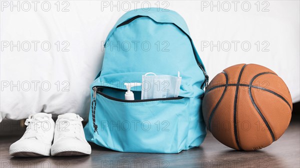 Back school arrangement with blue backpack