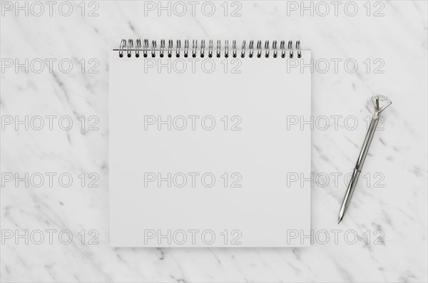 Top view white notebook marble desk