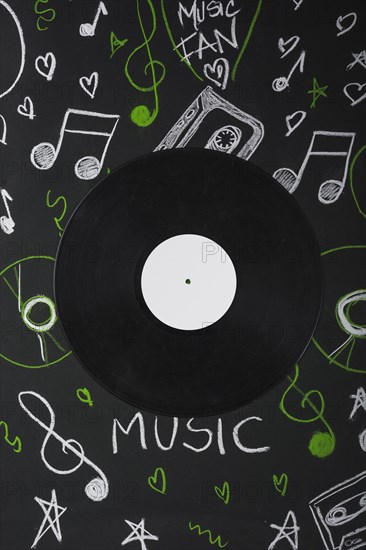 Vinyl record blackboard with drawn musical notes