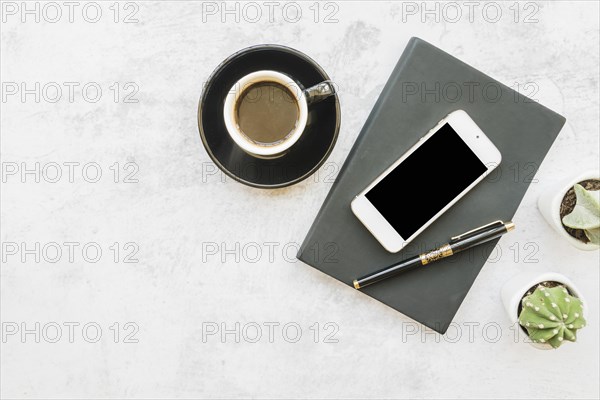 Smartphone coffee table with notebook