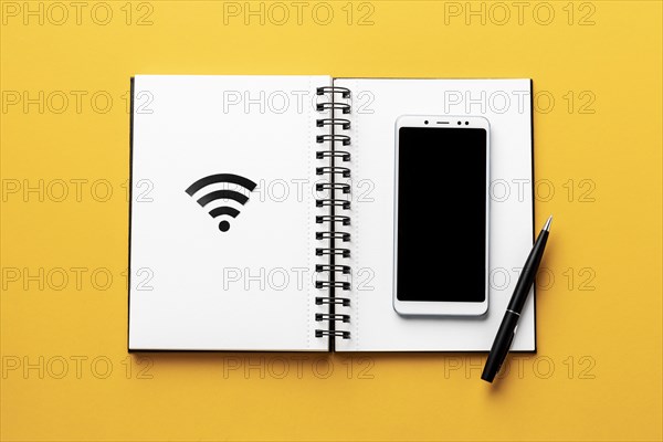 Top view wi fi symbol with notebook smartphone