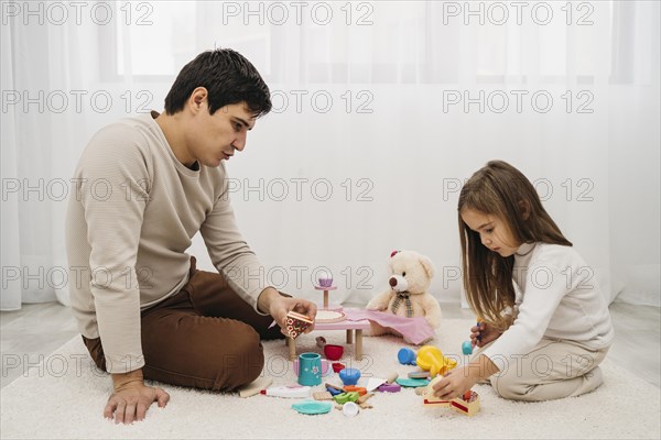 Father playing with his daughter