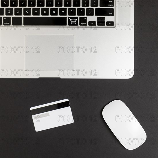 Top view laptop with mouse credit card