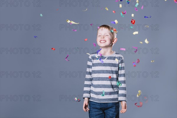 Cheerful boy confetti