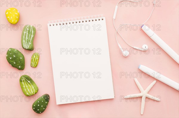 Blank notebook with earphones sea star