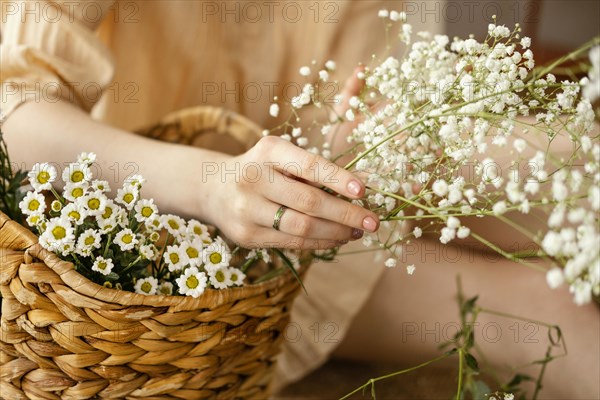Woman with basket spring flowers