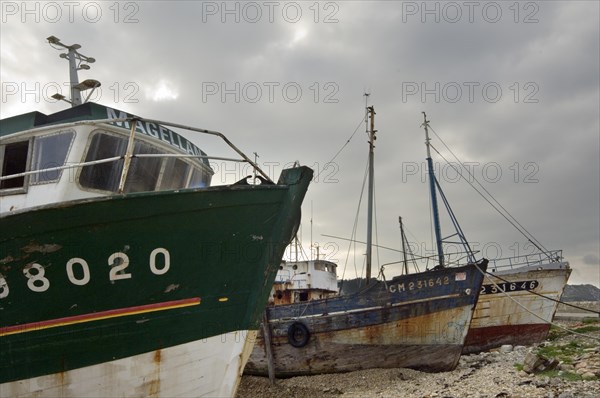 Wrecks of old trawler fishing boats in the harbour of Camaret-sur-Mer