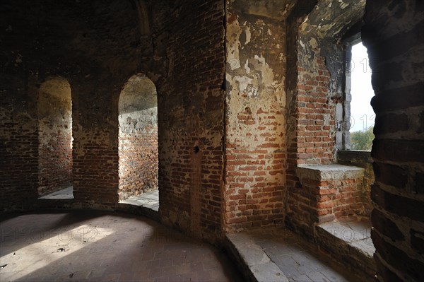 Room with window seat in recess inside medieval Beersel Castle