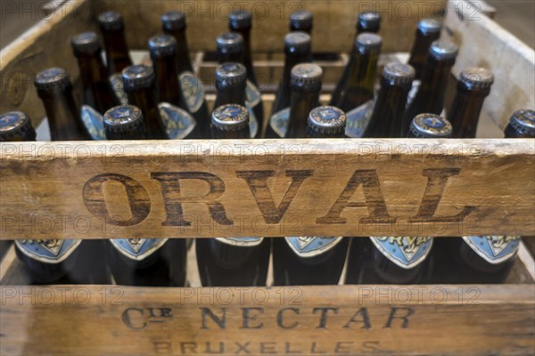 Orval Trappist beer bottles in vintage wooden crate at Orval Abbey