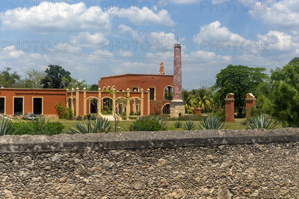 View from bus window of former henequen estate buildings of Hacienda Kinchil