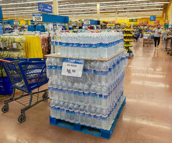 Goods and produce on display inside Walmart superstore shop store