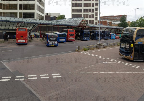 View through bus window of buses in bus station in the town centre