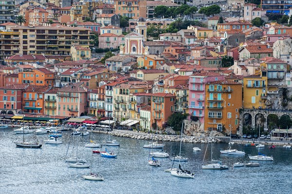 Sailing boats and colourful houses in the city Nice along the French Riviera