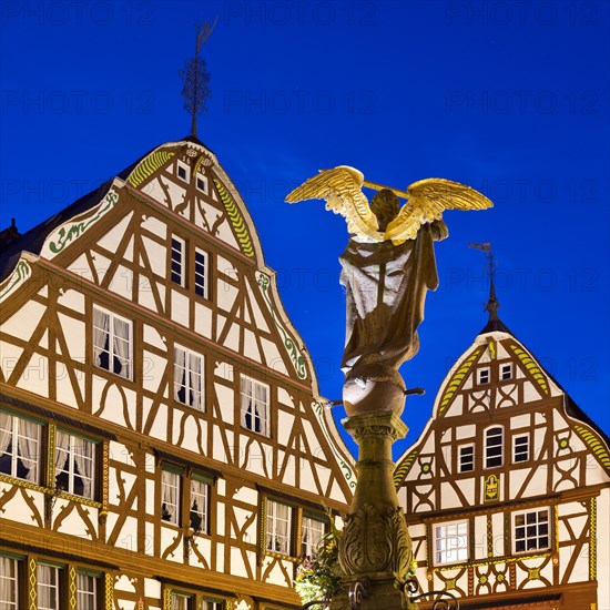 Gabled half-timbered houses with St. Michael's Fountain