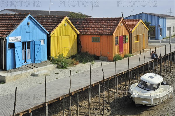 Colourful cabins of oyster farmers in the harbour at Le Chateau-d'Oleron on the island Ile d'Oleron