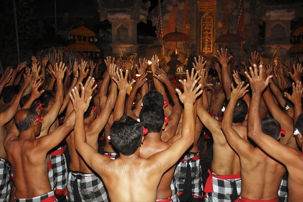 Waving hands during Kecak dance performance