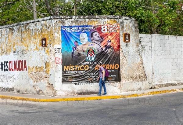 Poster on wall advertising wrestling sports event Vallodolid