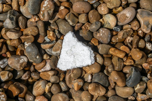 Piece of polystyrene foam washed up on shingle beach