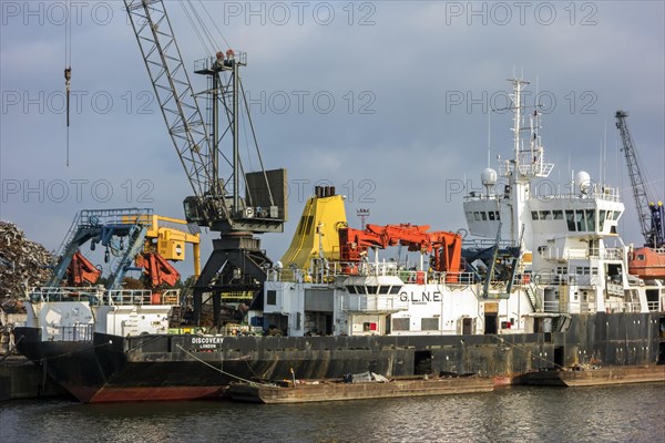 Old ship being dismantled to recycle scrap metal at Van Heyghen Recycling export terminal