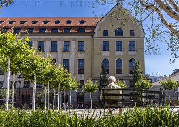 Senior sitting on a bench in the former parcel yard