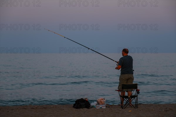 Anglers on the beach in Corsica