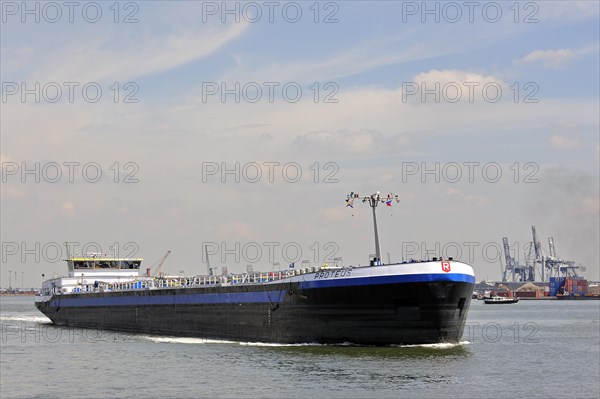Inland vessel sailing into dock of the Antwerp harbour
