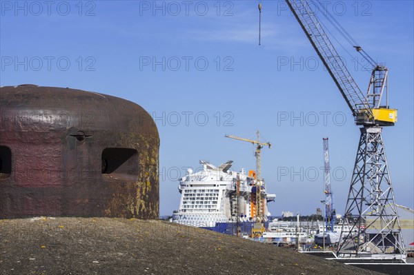 Steel turret from the German WW2 Kriegsmarine submarine base looking over the shipyard in the port of Saint-Nazaire