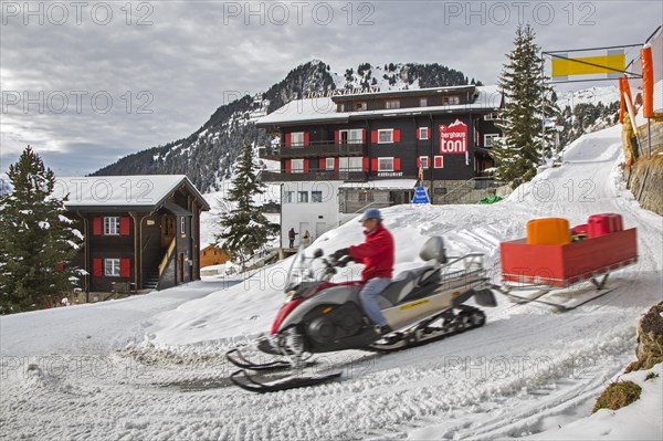 Man on snow scooter