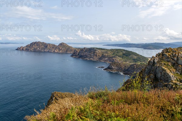 West facing steep cliffs view north from Isla del Faro