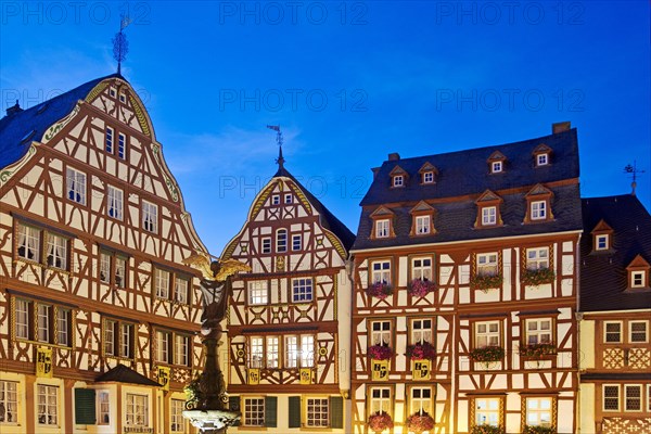 Gabled half-timbered houses on the medieval market square in the evening