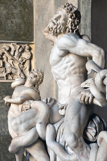 View of detail detail of Laocoon group historical sculpture in marble marble sculpture by ancient sculptor Laocoon group of priest Laocoon and sons fights fight with snake