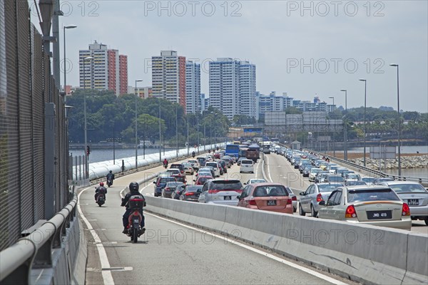 Cars in traffic jam during rushhour on the bridge from Malaysia to Singapore