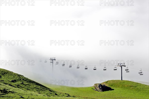 Chairlift in the mist at sunrise along the Col du Tourmalet in the Pyrenees