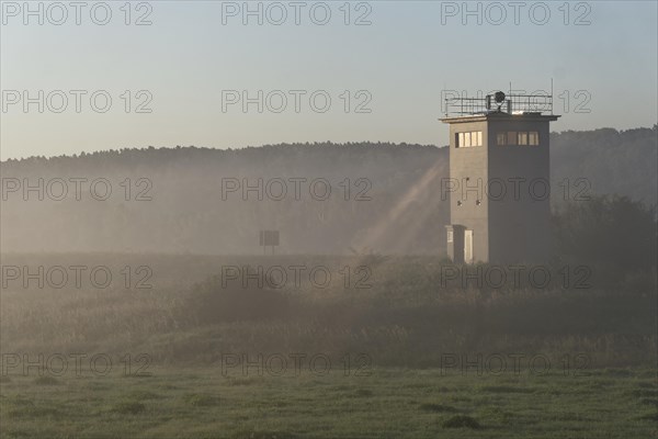Former GDR border tower in the early morning mist in the Elbe floodplain near Darchau in the Elbe River Landscape UNESCO Biosphere Reserve. Amt Neuhaus
