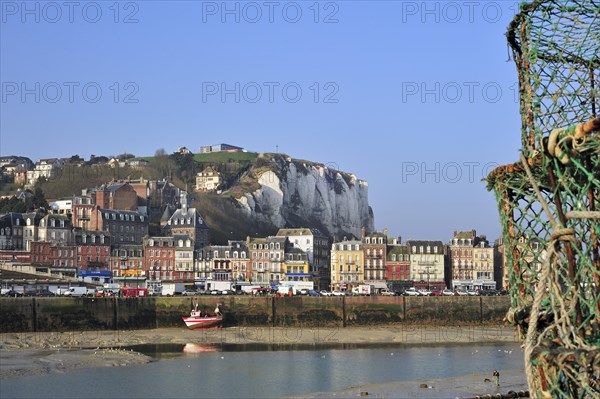 Lobster traps and view over the town Le Treport