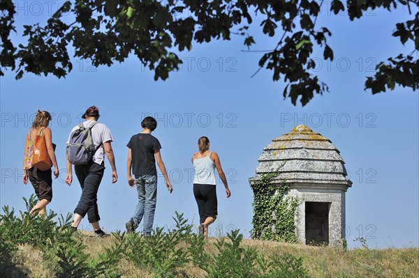 Turret and tourists walking on rampart of the citadel at Brouage