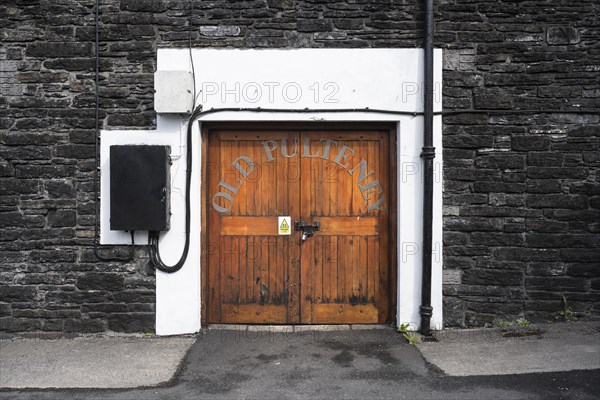 Wooden door to the warehouse of the Old Pulteney whisky distillery in Wick