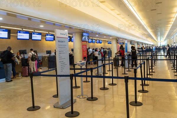 American Airlines airline check-in bag drop area inside Cancun airport