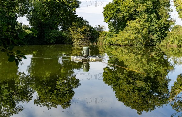 Water pump in loam pond fishing lake