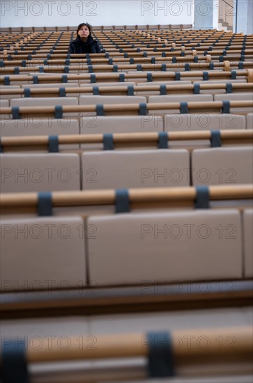 Woman Sitting Alone in St. Johann Reformed Church in Schaffhausen