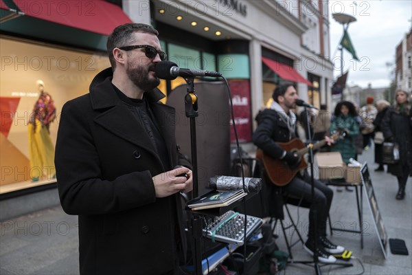 Andrew Kavanagh and Andrew Glover of the Irish rock group Keywest busking in Grafton Street. Dublin