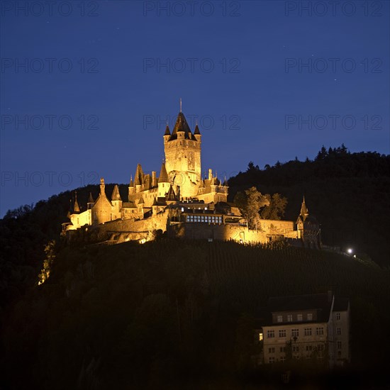 Illuminated Reichsburg Cochem in the evening